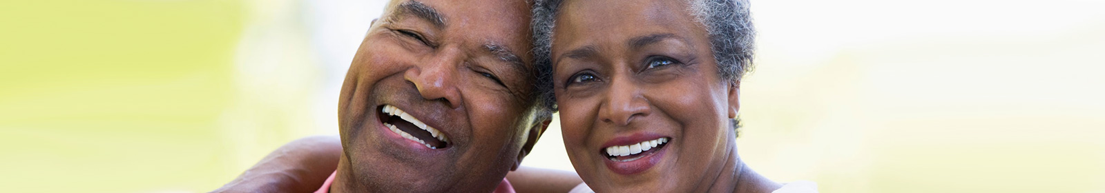 Happy african american couple after having implant placements